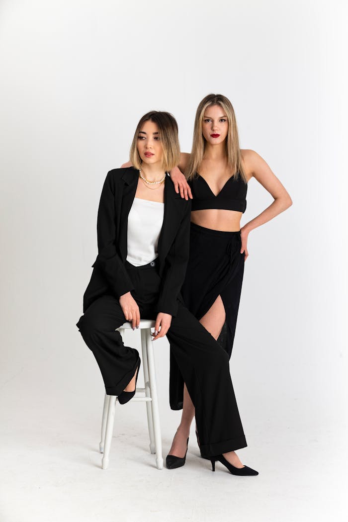 Crafting Captivating Headlines: Your awesome post title goes here Chic portrait of two young women in fashionable black outfits.