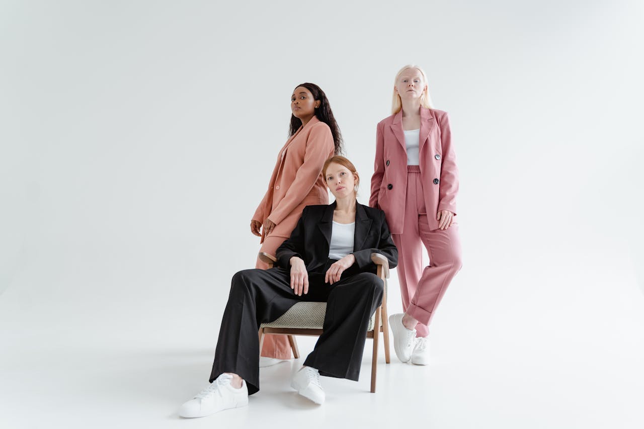 Mastering the First Impression: Your intriguing post title goes here Diverse group of women posing in modern suits on a white background.